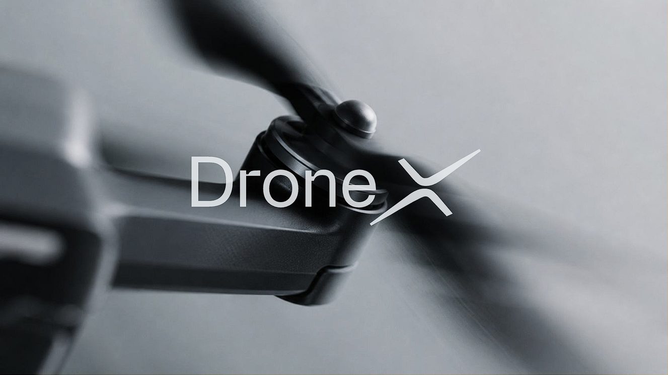 Close-up of a Drone X aircraft propeller in motion with the Drone X wordmark