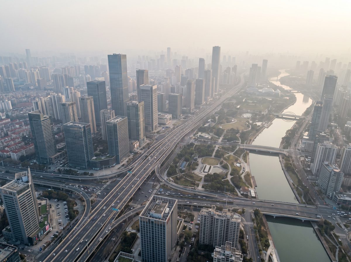 Aerial view of a city skyline with modern buildings and roads